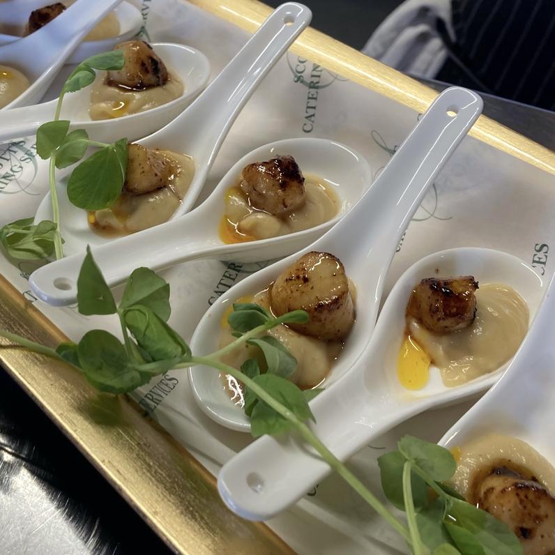 Seared Scallops, on Cauliflower Puree & Curry Oil.